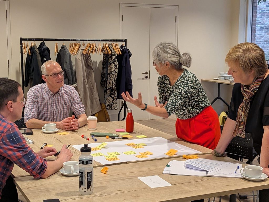 Members of the Centre team discussing their ideas.