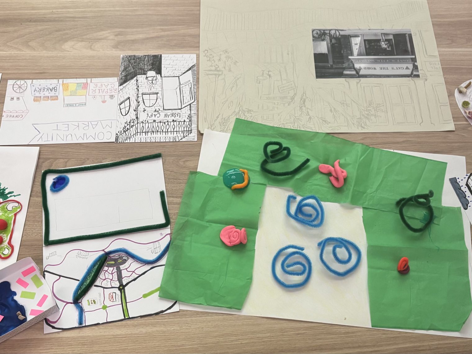 A selection of work from a town and country planning workshop featuring models, crafts, drawings and images.
