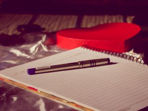 A notebook and pen ready for someone to write down their reflections.